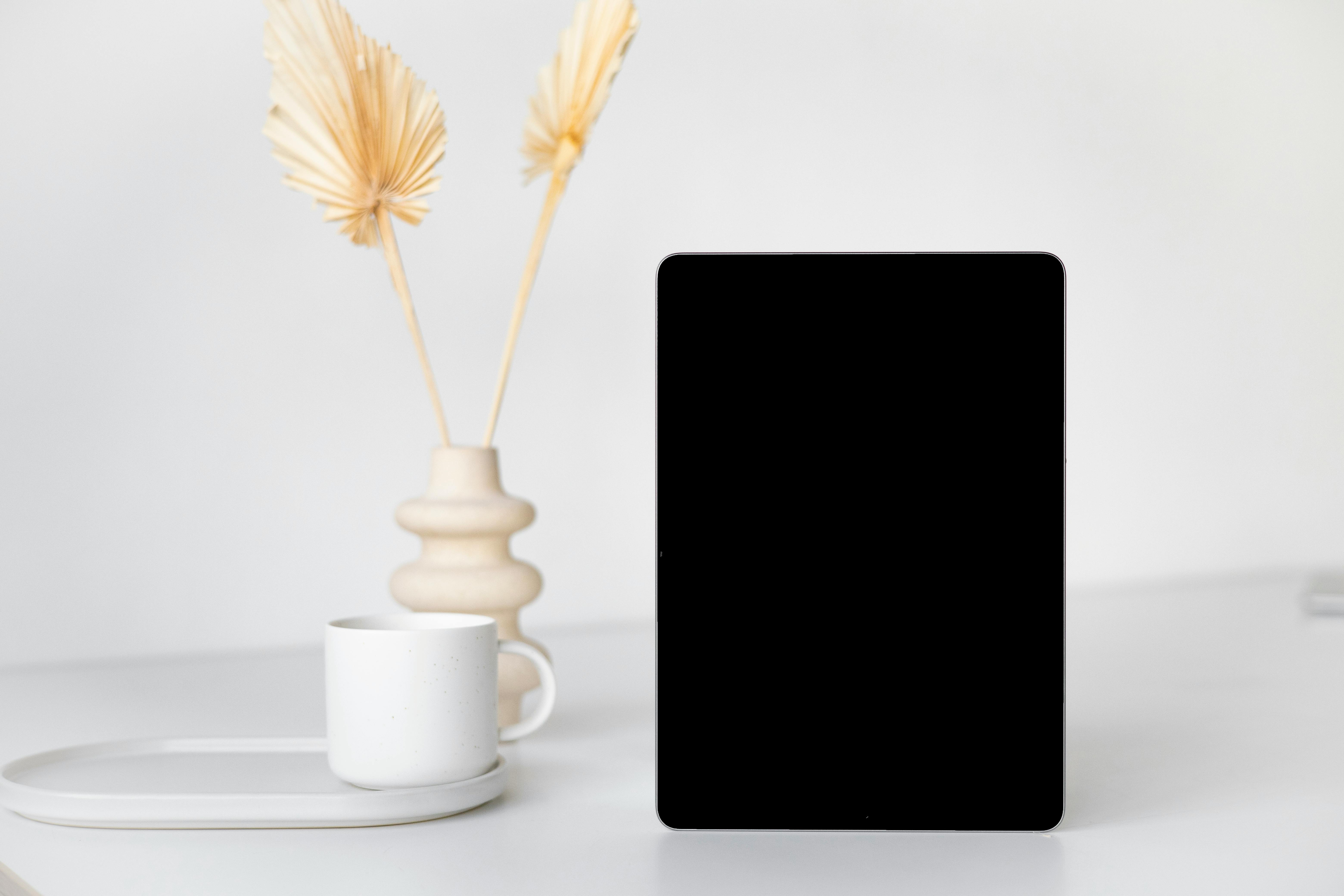 Cozy gaming setup with warm lighting, plants, and comfortable chair